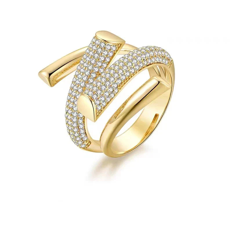 18K gold ring with pavé zircon crystals in a safety-pin design.
