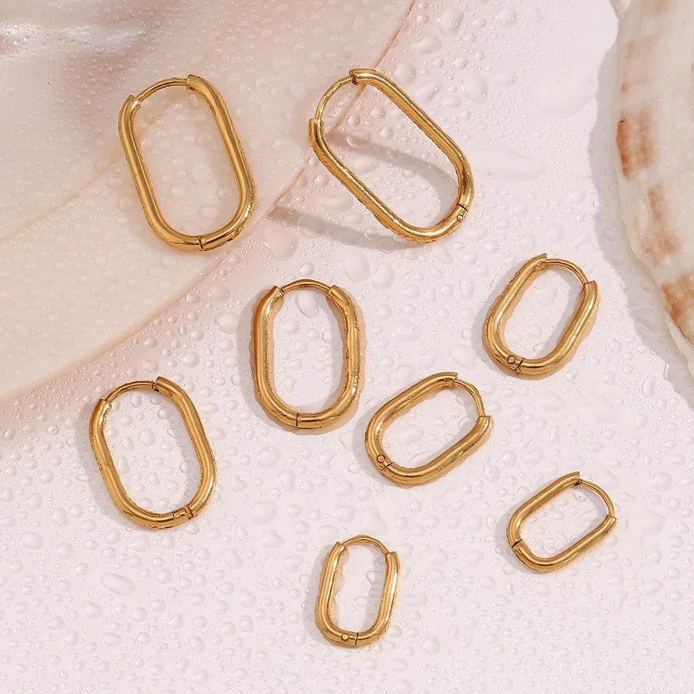 Gold-plated oval hoop earrings with geometric, hinged silhouettes for a contemporary edge